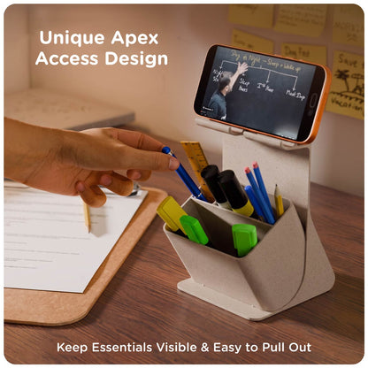 Hand reaching for a pen from the eo Apex organiser while a phone plays a video