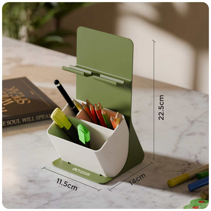 A green and white desk organizer with a hinged lid and pen holder, shown on a marble desk with dimension labels indicating 11.5cm, 14cm, and 22.